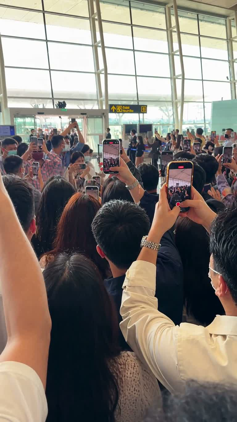 Celebrity Escort Through Airport Crowd and Boarding the Car