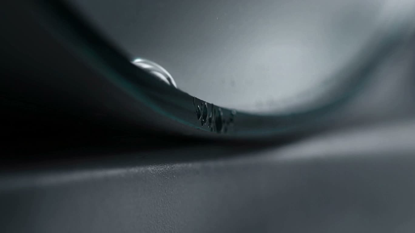 Surface Tension of a Mirror-Edge Water Drop