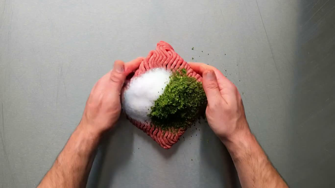 Overhead Cooking Loop of Molten Cheese Meatballs