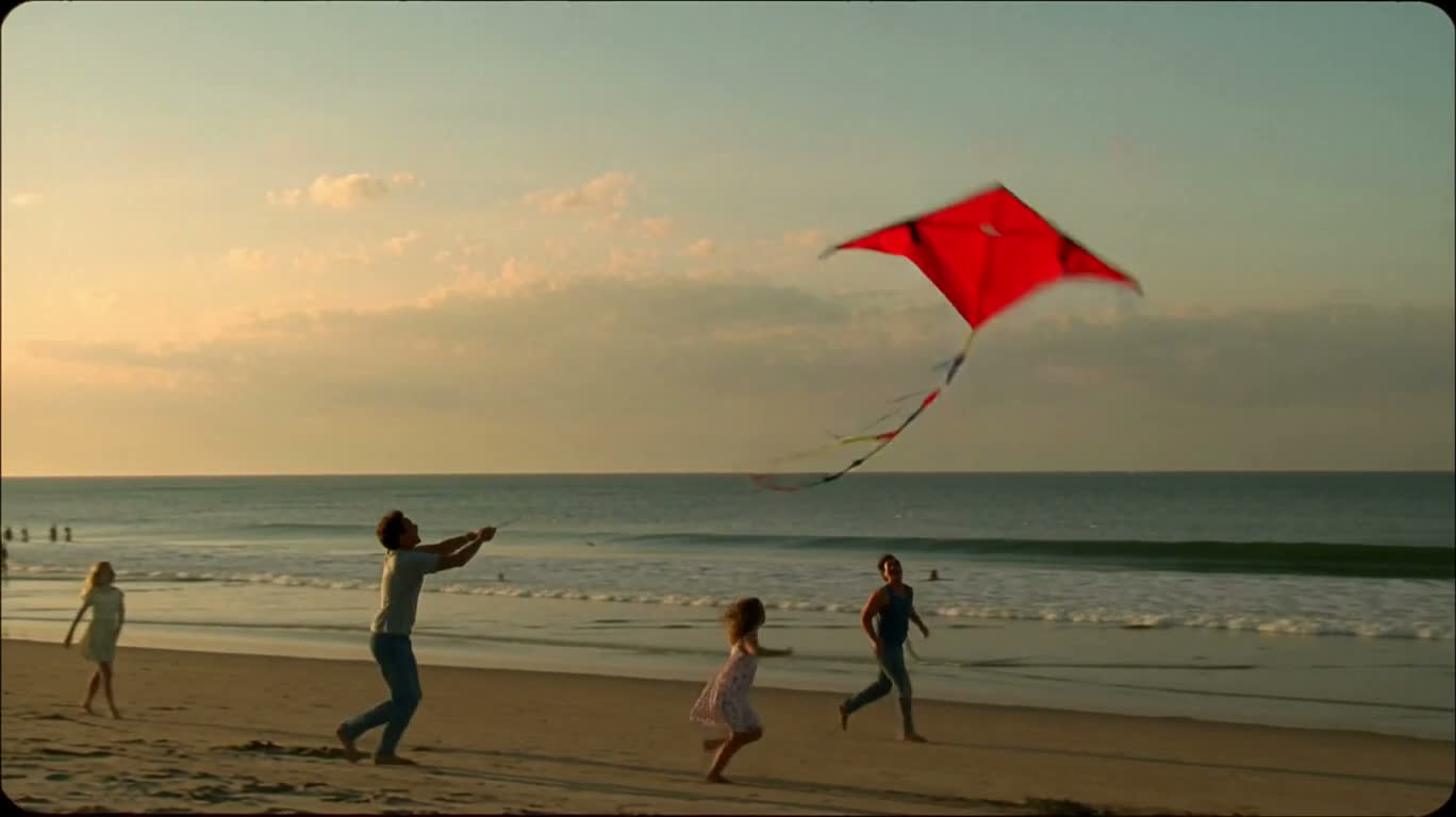 Cerf-volant rouge sur une plage au coucher du soleil — AI video creation
