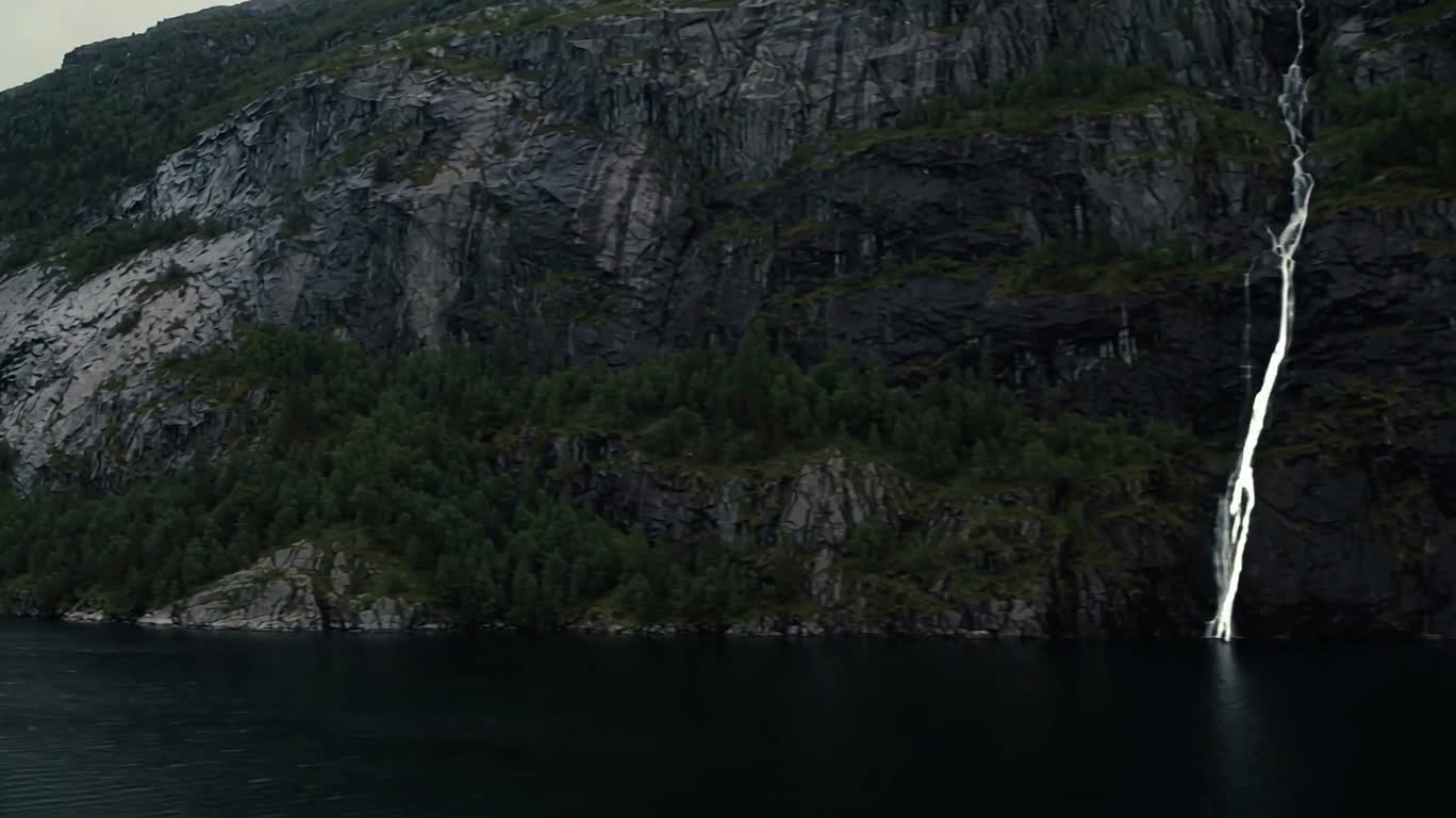 Fjord Cliffs and Still Waterfall