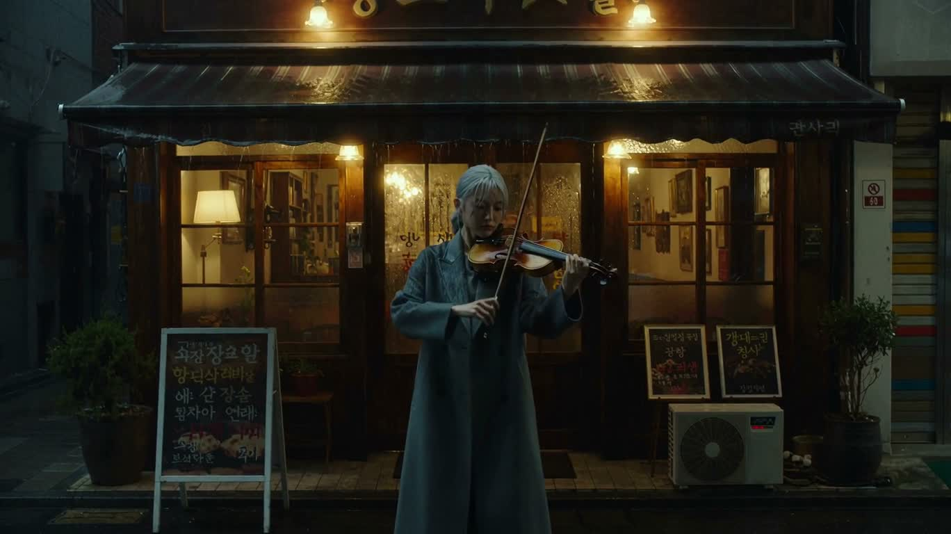 Violinist on a Rainy Night Porch