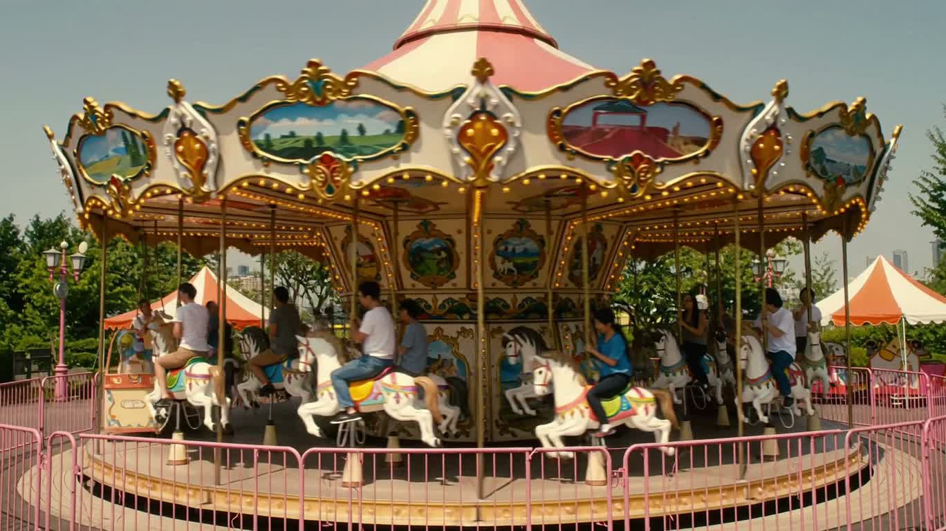 Joyful Father-Daughter Carousel Time