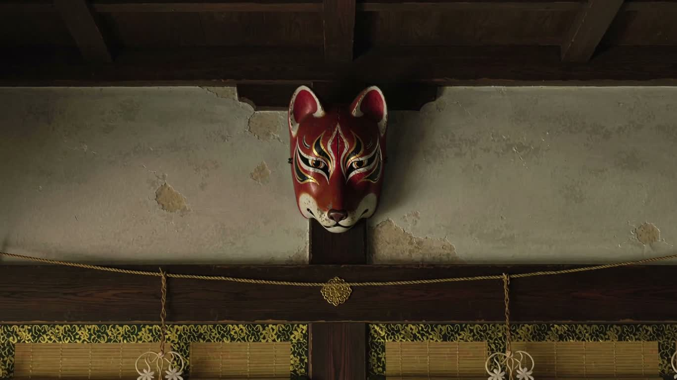 Fox Spirit Masks on an Old Shrine Wall