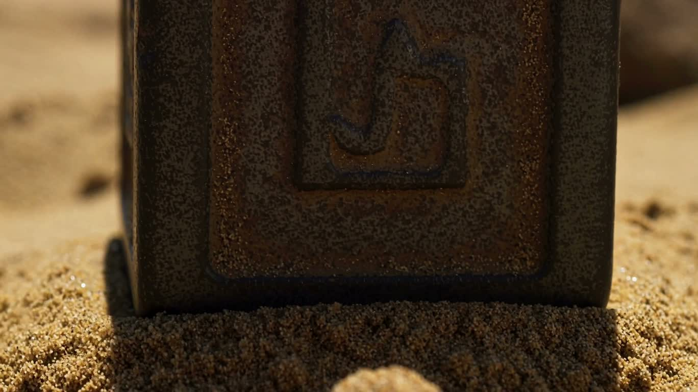 Heavy Objects Sinking Slowly in Golden Sand