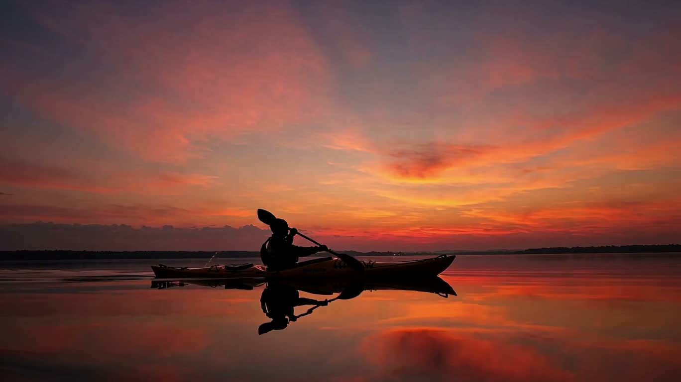 Solitary Boat on Calm Water at Sunset