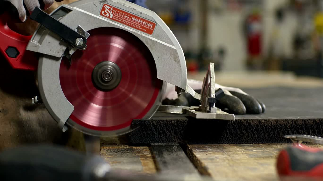 Circular Saw Cutting Black Rubber Sheet
