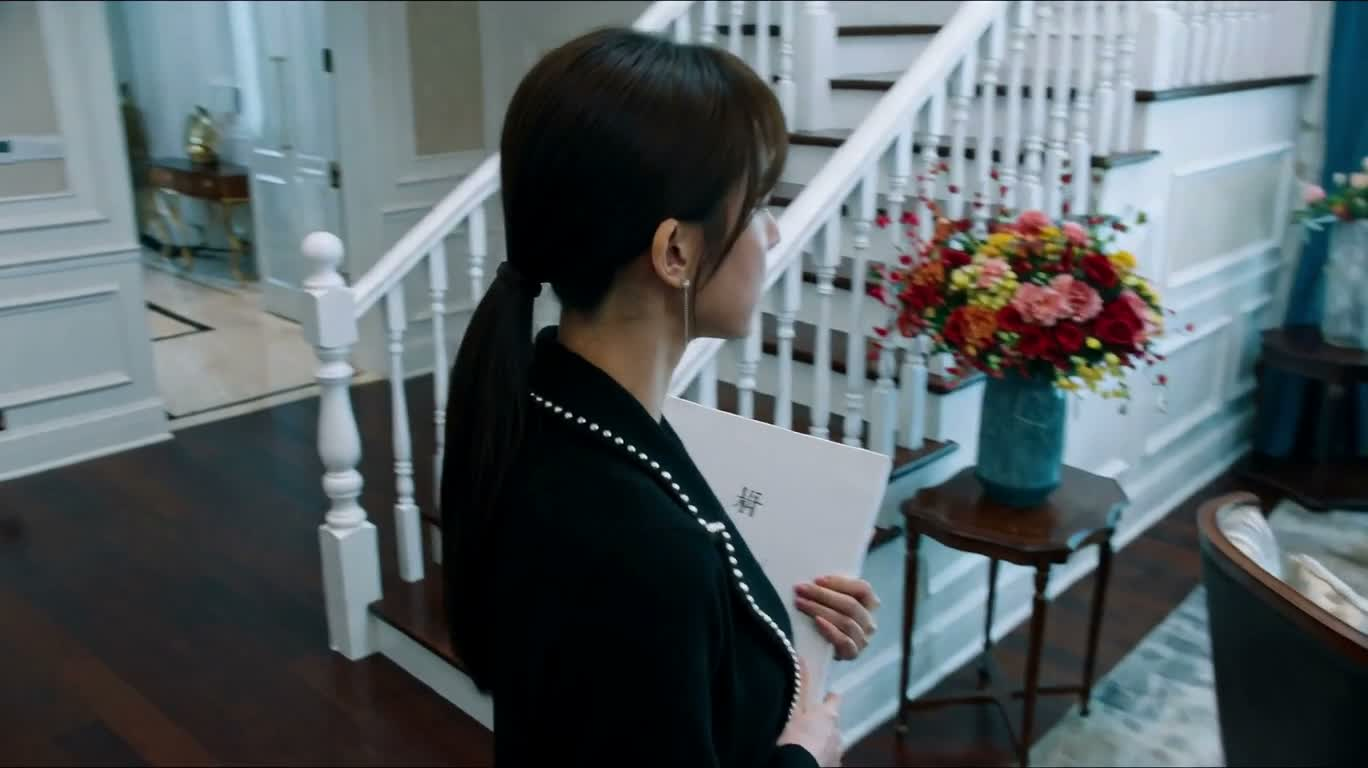 Mansion Foyer Assistant Arranging Books