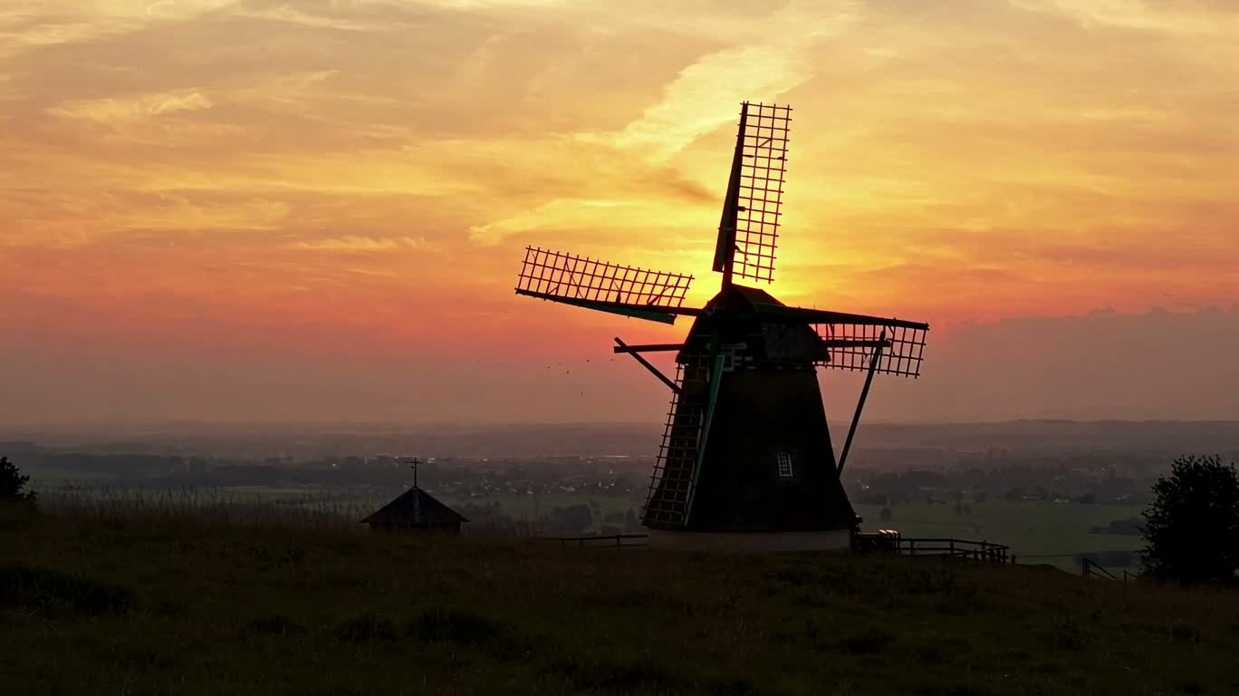 Moulins au sommet au coucher du soleil — AI video creation